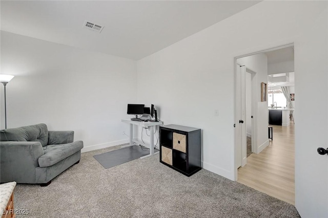 201 Crown Imperial St, Henderson, NV 89074 - carpeted living area with an office area and baseboards
