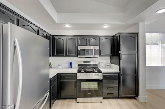 201 Crown Imperial St, Henderson, NV 89074 - kitchen featuring appliances with stainless steel finishes, light wood-type flooring, light countertops, and recessed lighting