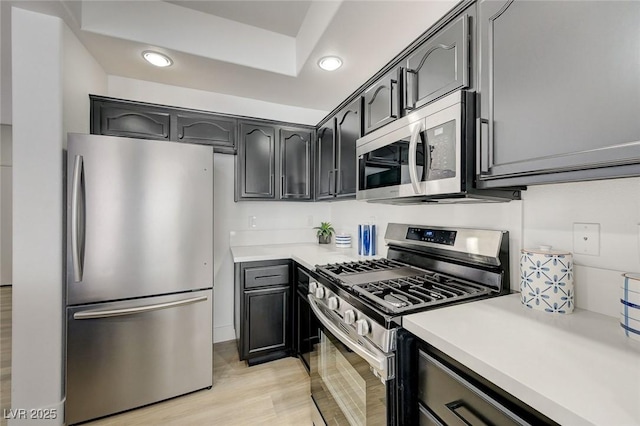 201 Crown Imperial St, Henderson, NV 89074 - kitchen featuring stainless steel appliances, recessed lighting, light countertops, and light wood-style flooring