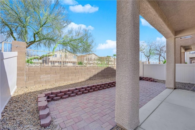 8658 Tom Noon Ave Unit 103, Las Vegas, NV 89178 - fenced backyard with a patio