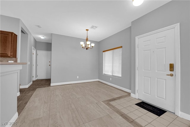 8658 Tom Noon Ave Unit 103, Las Vegas, NV 89178 - entrance foyer featuring a chandelier and baseboards