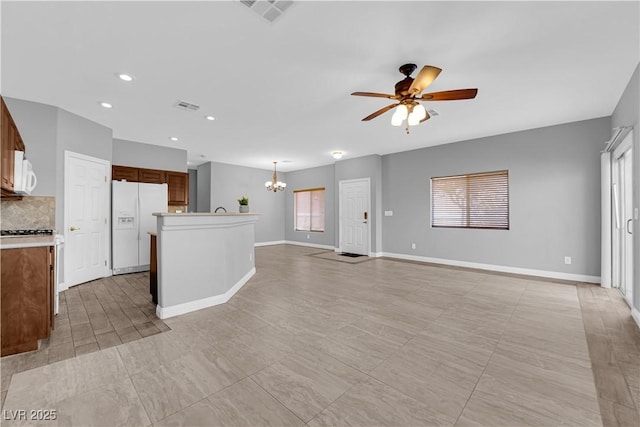 8658 Tom Noon Ave Unit 103, Las Vegas, NV 89178 - unfurnished living room with a chandelier, ceiling fan, and recessed lighting