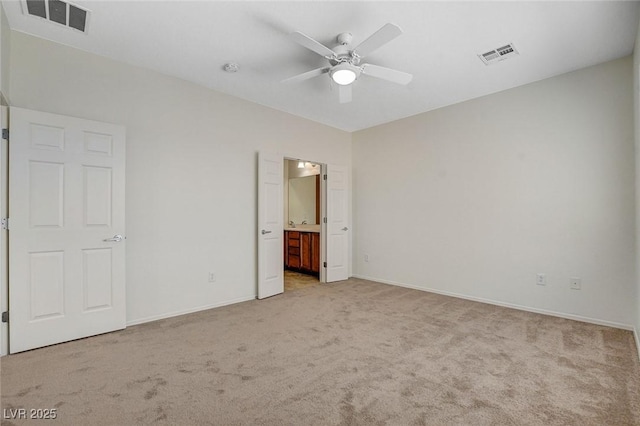 2508 Chasma Dr, Henderson, NV 89044 - unfurnished bedroom featuring light colored carpet, ensuite bathroom, and ceiling fan