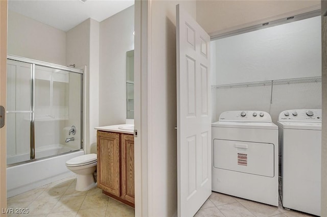 2508 Chasma Dr, Henderson, NV 89044 - washroom with washing machine and clothes dryer and light tile patterned floors