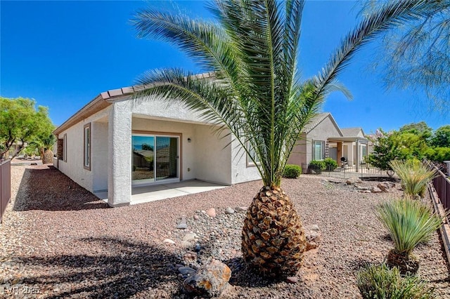 2508 Chasma Dr, Henderson, NV 89044 - rear view of property featuring stucco siding and a patio area