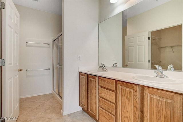 2508 Chasma Dr, Henderson, NV 89044 - full bath with double vanity, a stall shower, tile patterned floors, and a spacious closet