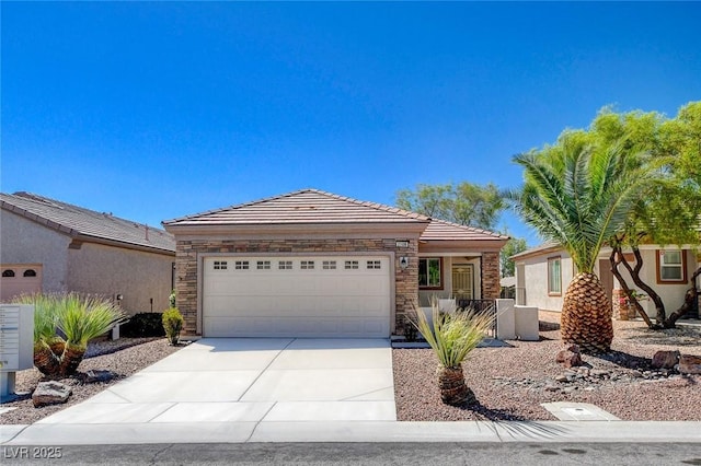 2508 Chasma Dr, Henderson, NV 89044 - ranch-style home featuring an attached garage, concrete driveway, a tile roof, stone siding, and stucco siding