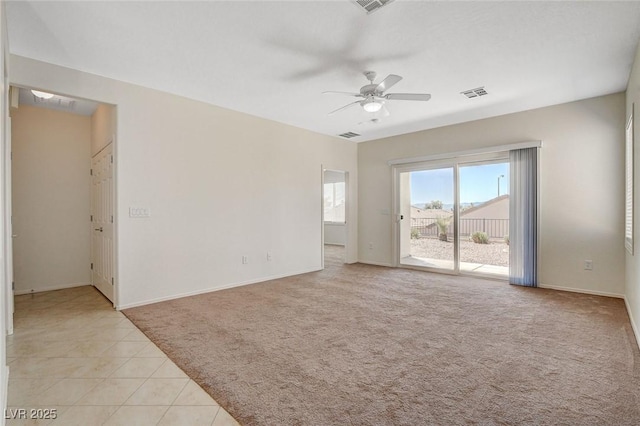 2508 Chasma Dr, Henderson, NV 89044 - empty room featuring light carpet, ceiling fan, and light tile patterned floors