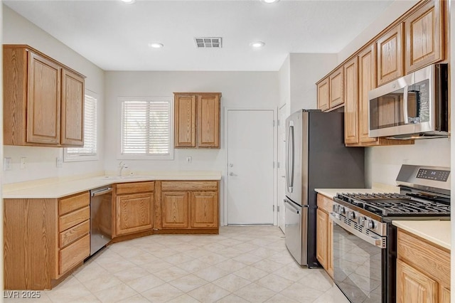 2508 Chasma Dr, Henderson, NV 89044 - kitchen with stainless steel appliances, light countertops, and recessed lighting