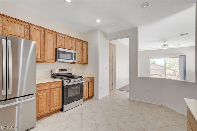 2508 Chasma Dr, Henderson, NV 89044 - kitchen with appliances with stainless steel finishes, light countertops, recessed lighting, and a ceiling fan