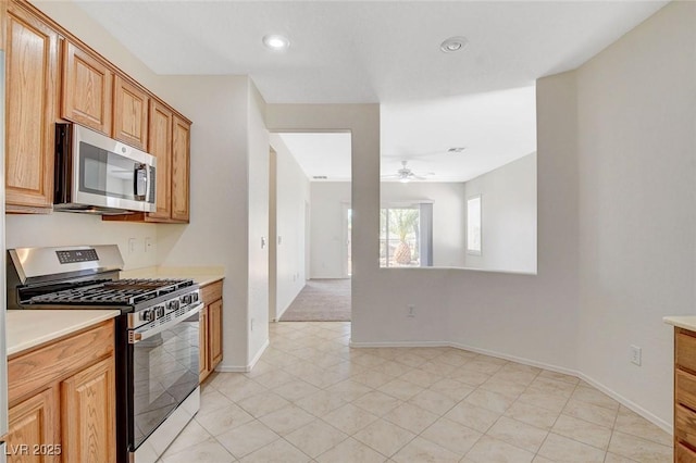 2508 Chasma Dr, Henderson, NV 89044 - kitchen featuring appliances with stainless steel finishes, a ceiling fan, light countertops, recessed lighting, and light tile patterned floors