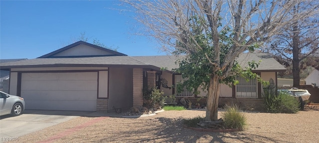 1886 Ludington Ave, Las Vegas, NV 89156 - ranch-style home featuring concrete driveway, a garage, and a shingled roof