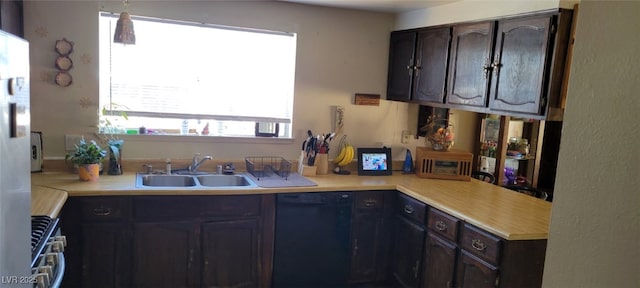1886 Ludington Ave, Las Vegas, NV 89156 - kitchen with dishwasher, light countertops, stainless steel range with gas cooktop, and dark brown cabinets