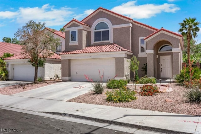 124 Wynntry Dr, Henderson, NV 89074 - mediterranean / spanish home with a tile roof, stucco siding, and concrete driveway