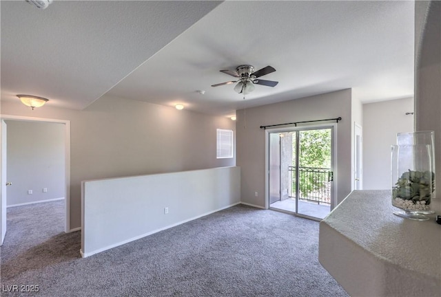 9050 W Warm Springs Rd Unit 2062, Las Vegas, NV 89148 - unfurnished living room with carpet floors and a ceiling fan