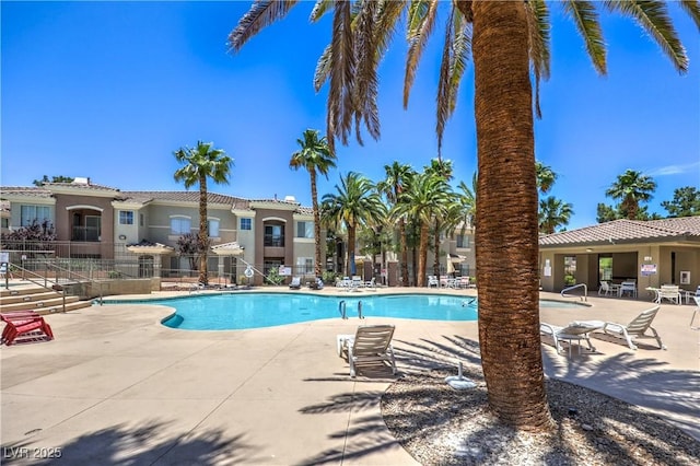 9050 W Warm Springs Rd Unit 2062, Las Vegas, NV 89148 - community pool featuring a patio