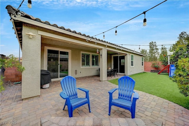 2433 Amatrice St, Henderson, NV 89044 - fenced backyard featuring a patio area and area for grilling