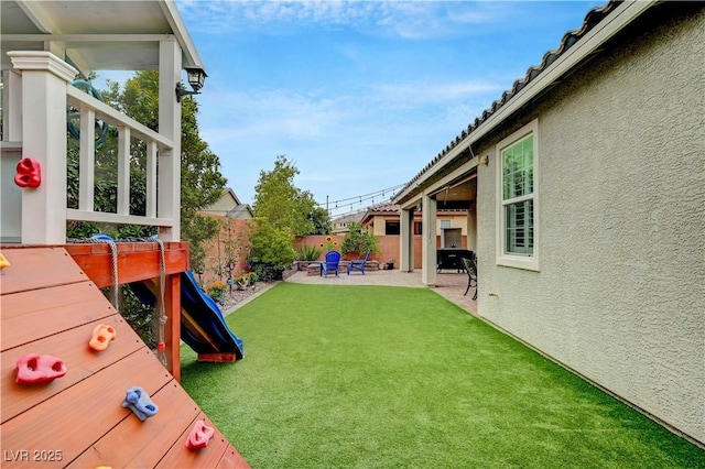 2433 Amatrice St, Henderson, NV 89044 - fenced backyard featuring a patio area