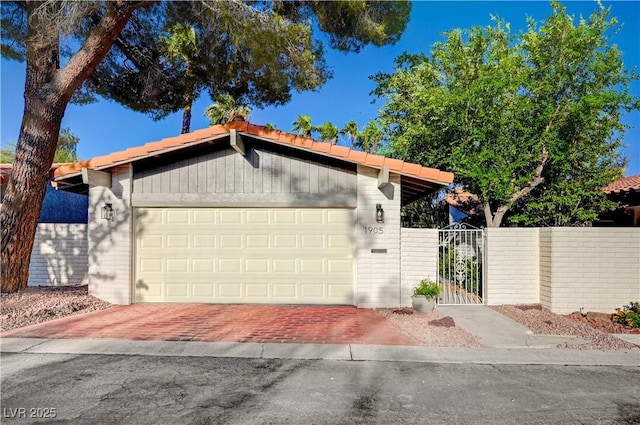 1905 Plaza Del Padre, Las Vegas, NV 89102 - view of front of house with a gate, decorative driveway, and an attached garage
