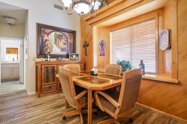 816 Sandsprings St, Henderson, NV 89011 - dining area with light wood-style flooring and a chandelier