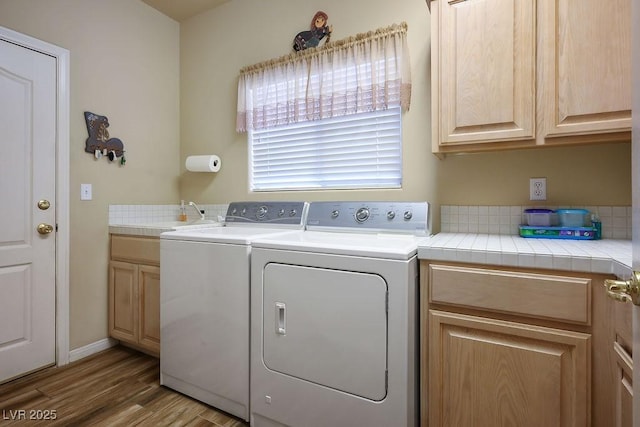 816 Sandsprings St, Henderson, NV 89011 - washroom with washer and dryer, cabinet space, and wood finished floors