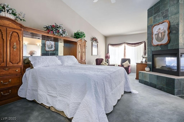 816 Sandsprings St, Henderson, NV 89011 - bedroom featuring carpet flooring, a tiled fireplace, and lofted ceiling