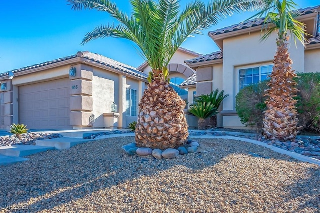 816 Sandsprings St, Henderson, NV 89011 - mediterranean / spanish-style house with a tile roof, a garage, and stucco siding