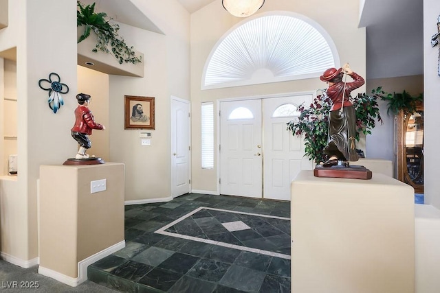 816 Sandsprings St, Henderson, NV 89011 - entryway with dark stone finish floors and baseboards