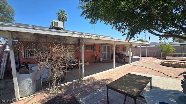 2965 Palma Vista Cir, Las Vegas, NV 89169 - back of property featuring a patio and an outdoor fire pit