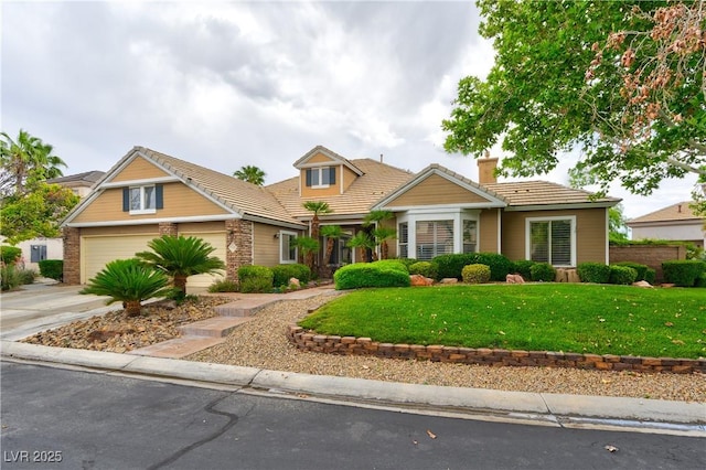 1704 River Birch St, Las Vegas, NV 89117 - view of front facade with a tiled roof, a front yard, driveway, a chimney, and an attached garage