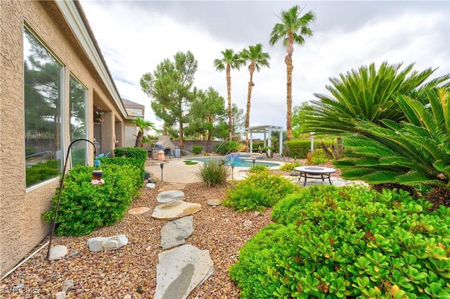 1704 River Birch St, Las Vegas, NV 89117 - fenced backyard with a patio and an outdoor pool
