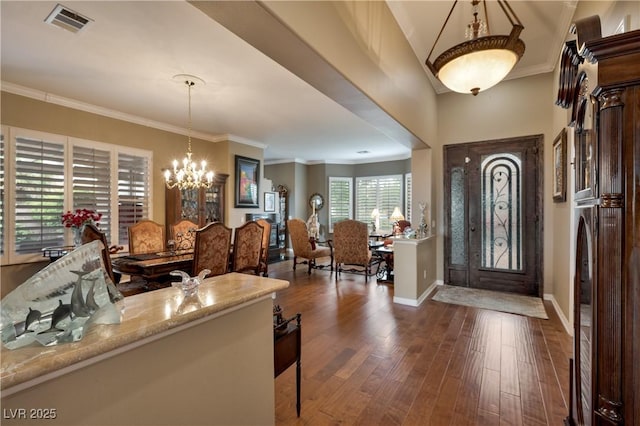 1704 River Birch St, Las Vegas, NV 89117 - entryway featuring a chandelier, dark wood-type flooring, and crown molding