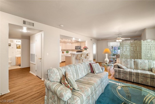 7950 W Flamingo Rd Unit 1024, Las Vegas, NV 89147 - living area with light wood finished floors and a ceiling fan