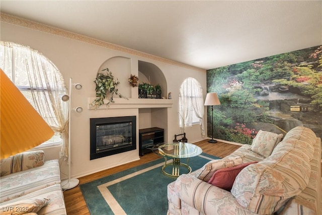 7950 W Flamingo Rd Unit 1024, Las Vegas, NV 89147 - living area with a glass covered fireplace and wood finished floors