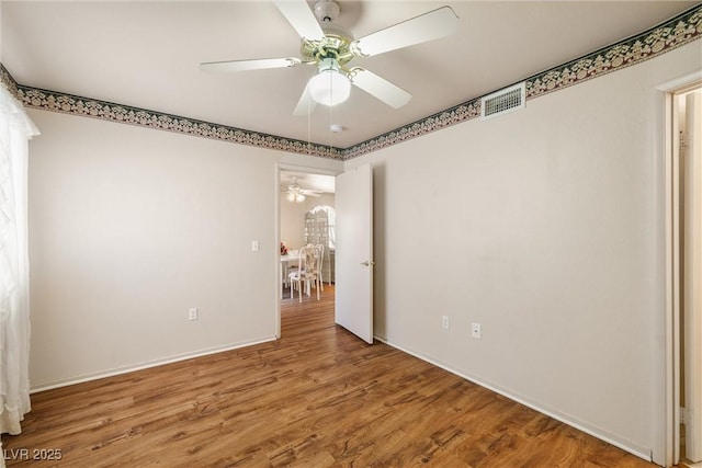 7950 W Flamingo Rd Unit 1024, Las Vegas, NV 89147 - unfurnished bedroom with wood finished floors and a ceiling fan
