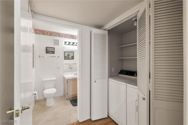 7950 W Flamingo Rd Unit 1024, Las Vegas, NV 89147 - laundry room featuring light tile patterned floors and washer and dryer