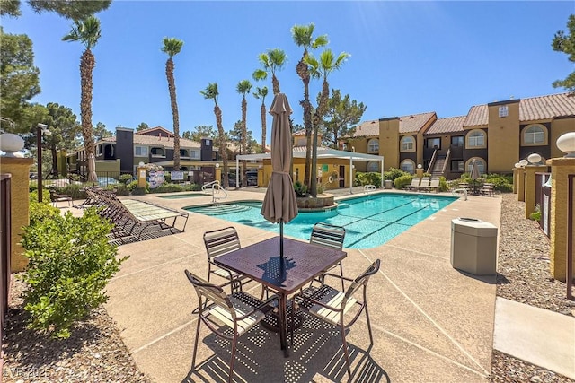 7950 W Flamingo Rd Unit 1024, Las Vegas, NV 89147 - community pool featuring a patio and a residential view