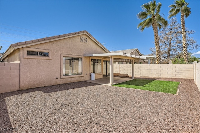 1038 Silver Creek Ave, Las Vegas, NV 89183 - back of house with a fenced backyard, stucco siding, and a patio