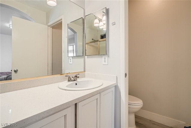 1038 Silver Creek Ave, Las Vegas, NV 89183 - ensuite bathroom featuring vanity and wood finished floors