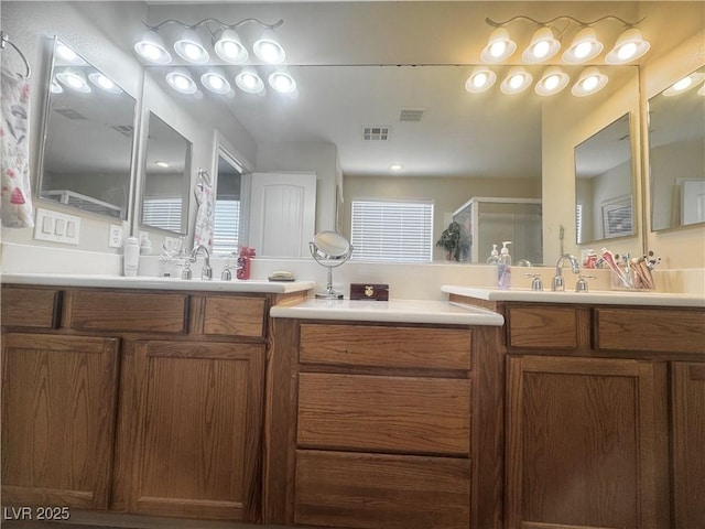 6922 Majestic Palm Dr, Las Vegas, NV 89122 - bathroom with two vanities and a stall shower