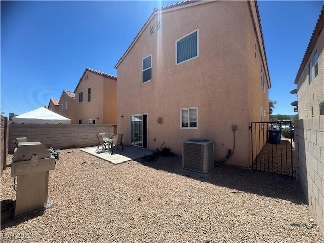 6922 Majestic Palm Dr, Las Vegas, NV 89122 - rear view of house featuring stucco siding, a patio, a fenced backyard, and a gate