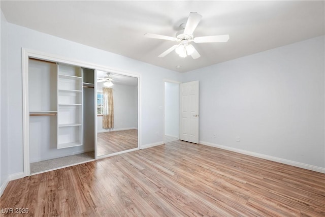 901 E Jaybird St, Pahrump, NV 89048 - unfurnished bedroom with a closet, light wood-type flooring, and a ceiling fan