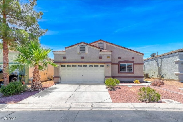 1717 Dwayne Stedman Ave, Las Vegas, NV 89106 - view of front of property with stucco siding, concrete driveway, an attached garage, and a tile roof