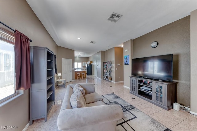 1717 Dwayne Stedman Ave, Las Vegas, NV 89106 - living room with baseboards and light tile patterned flooring