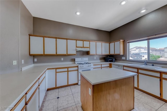 1717 Dwayne Stedman Ave, Las Vegas, NV 89106 - kitchen with white appliances, under cabinet range hood, light countertops, recessed lighting, and light tile patterned floors