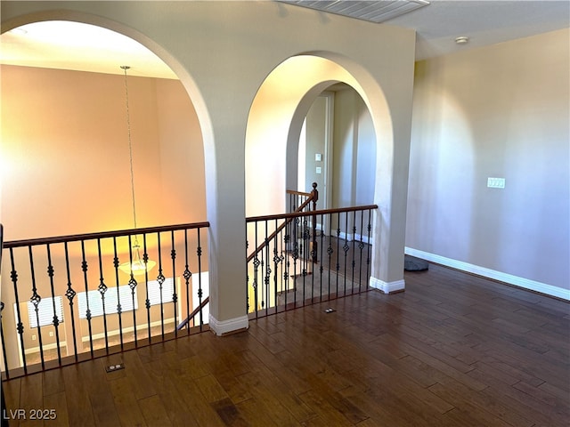 585 Via Alhambra, Las Vegas, NV 89123 - hallway with wood finished floors and an upstairs landing