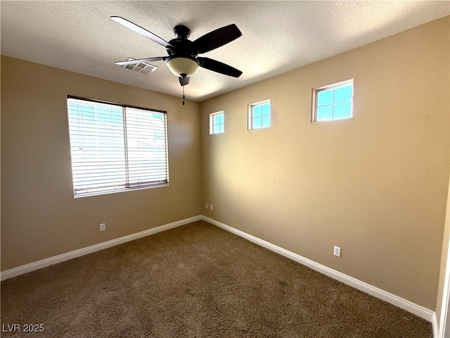 585 Via Alhambra, Las Vegas, NV 89123 - empty room featuring dark colored carpet, a textured ceiling, and ceiling fan