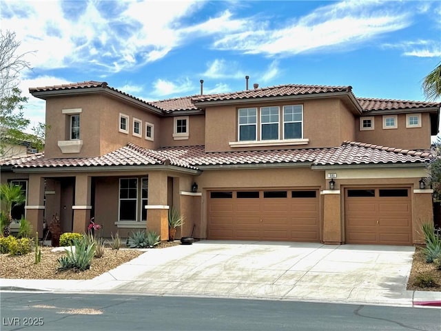 585 Via Alhambra, Las Vegas, NV 89123 - view of front of house with an attached garage, driveway, and stucco siding