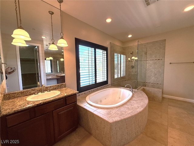 585 Via Alhambra, Las Vegas, NV 89123 - bathroom with a walk in shower, a whirlpool tub, vanity, tile patterned flooring, and recessed lighting
