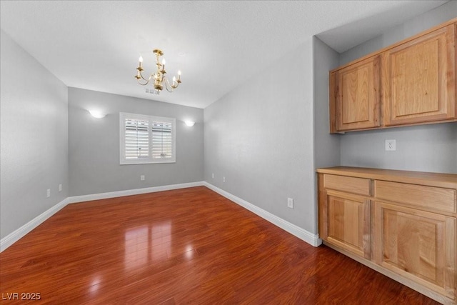 4029 Ricebird Way N, Las Vegas, NV 89084 - unfurnished dining area with a chandelier and dark wood-type flooring